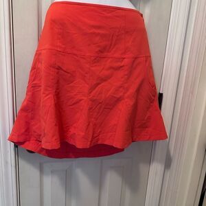 Cutter & Buck golf skort- orange- has two side pockets & attached shorts- 12
